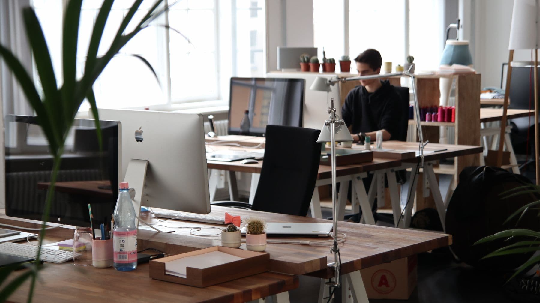 Office desks and computers — illustrative of voice over the internet