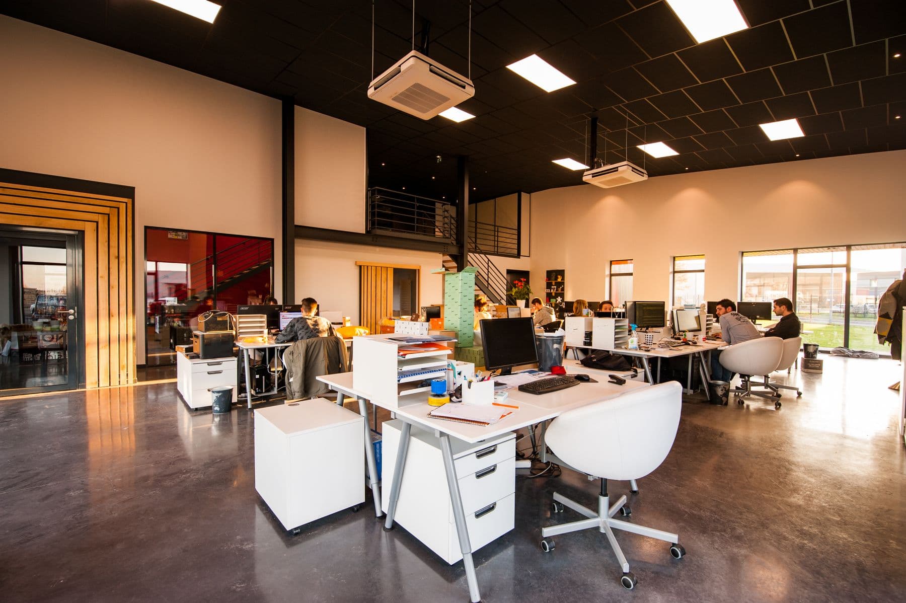 Open-plan office — illustrative of business communication